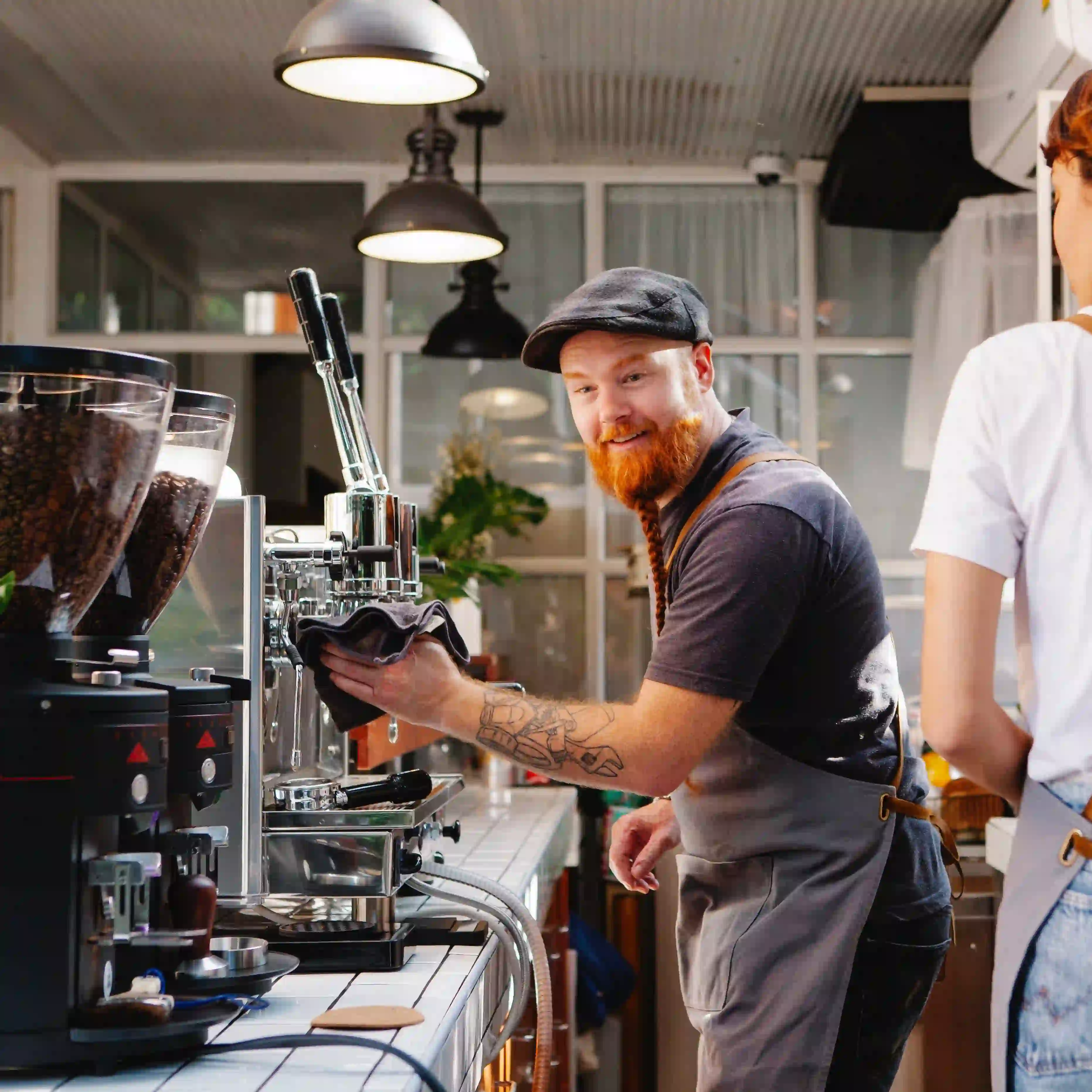 Baristas at the coffee machines.